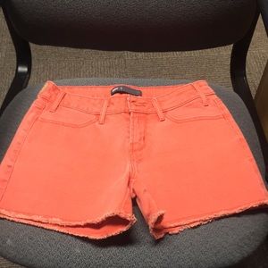 Size 27 orange Levi Jean shorts
